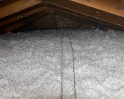 Attic insulation with spray foam for energy savings and temperature control.