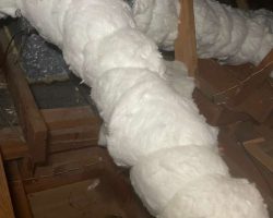 Attic insulation with spray foam for energy efficiency.